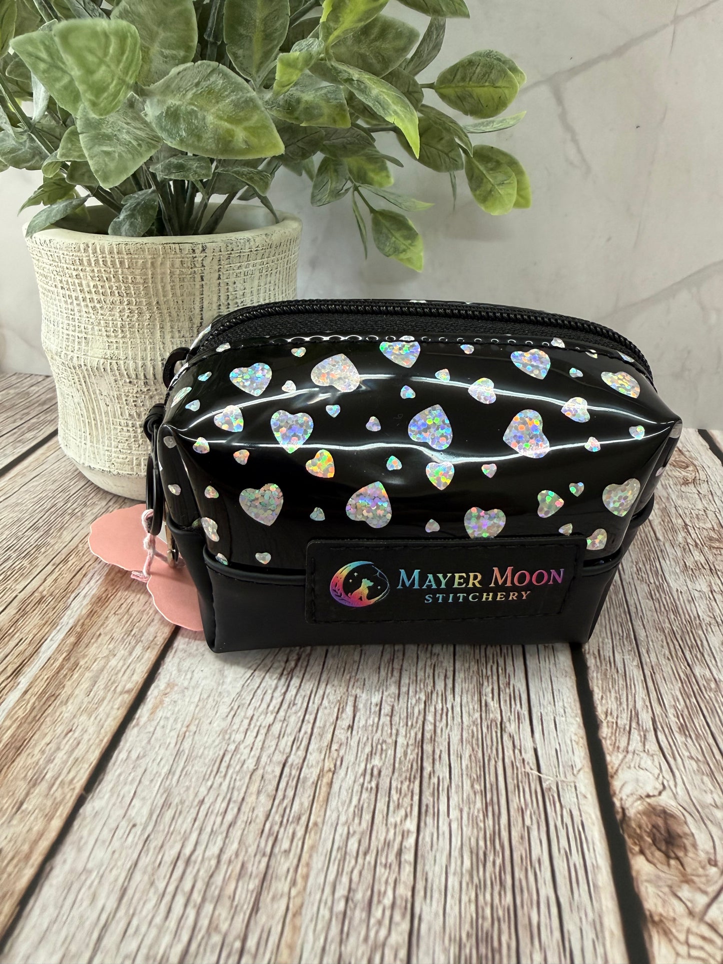 2x5 black boxy bag with silver hearts and swivel clasp